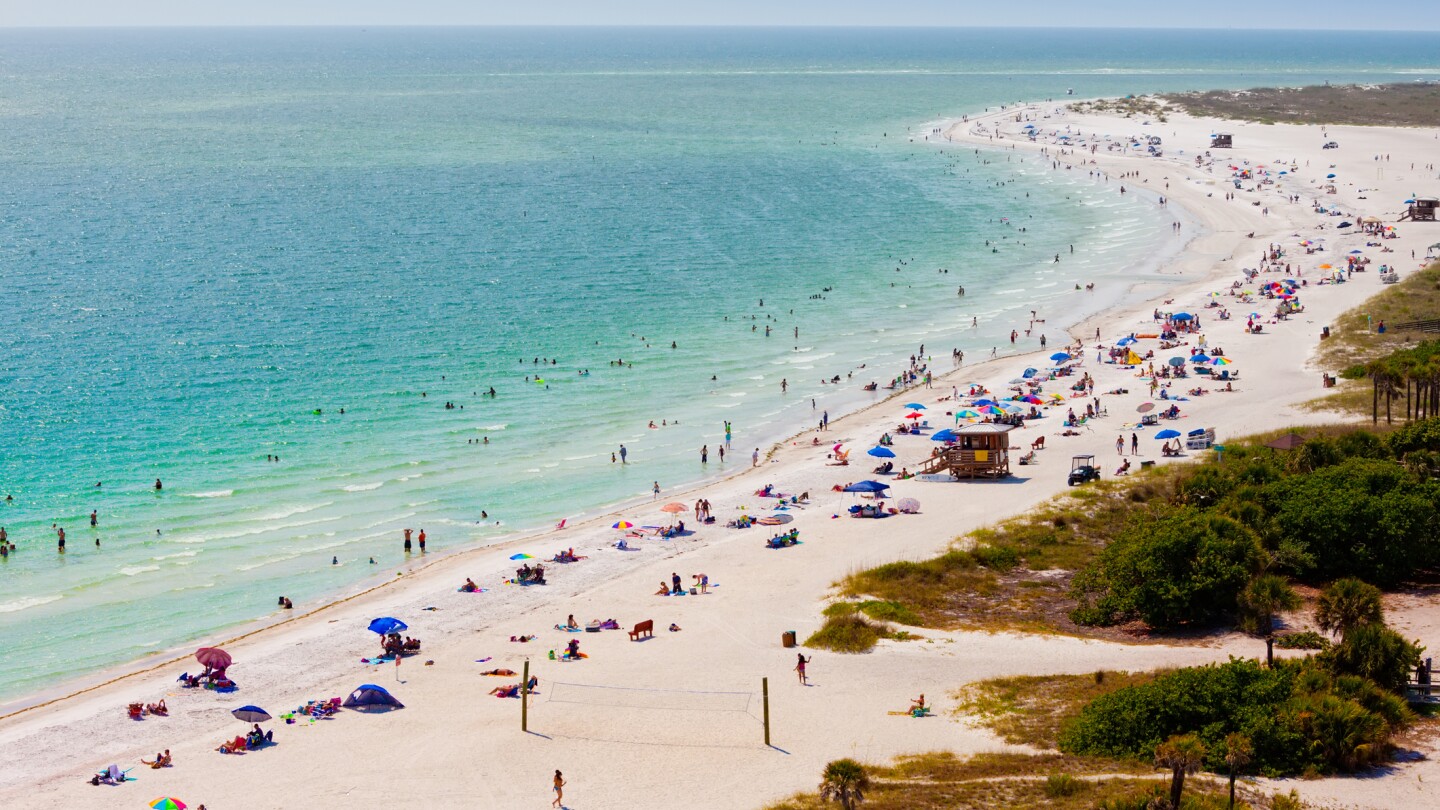 Beach goers on Lido Beach in Sarasota, FL