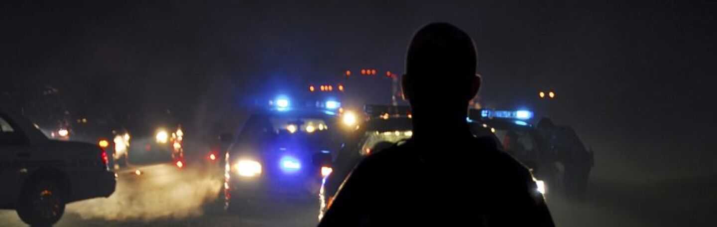 Kronos_police_man_and_car_a.jpg