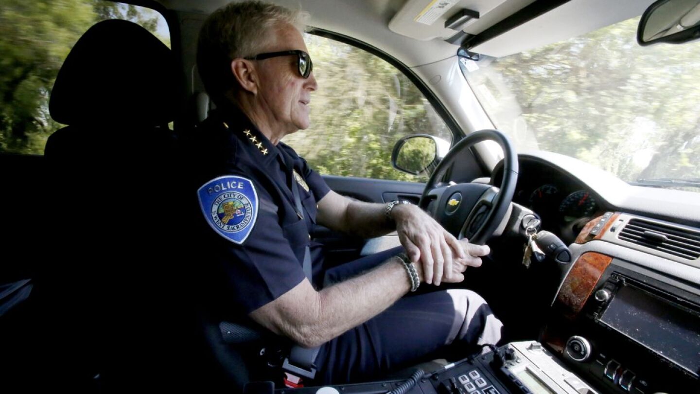 Police officer in patrol car on duty