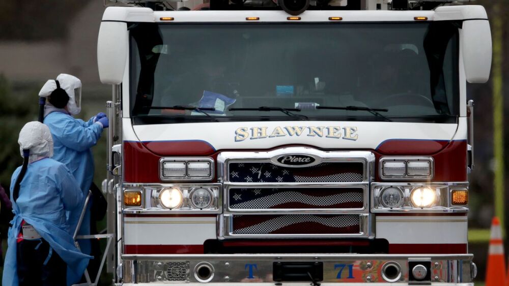 kansas hazard pay essential workers associated press stock image