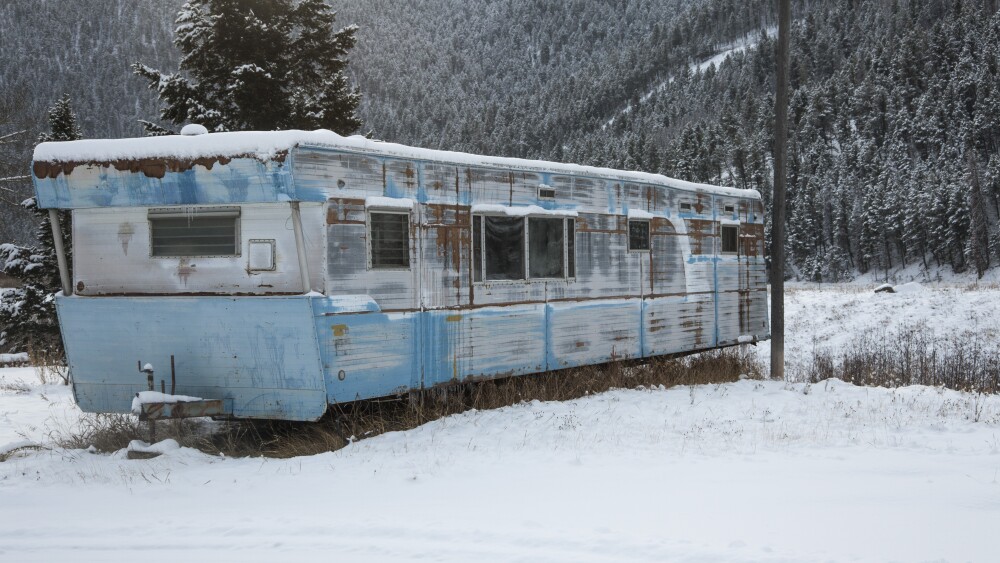 Abandoned Trailer Home with Snow