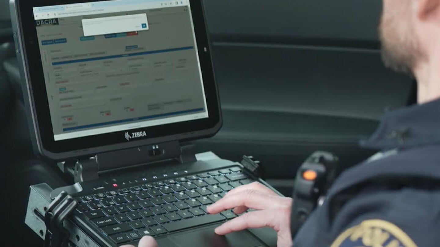 Police officers at surveillance control center wide