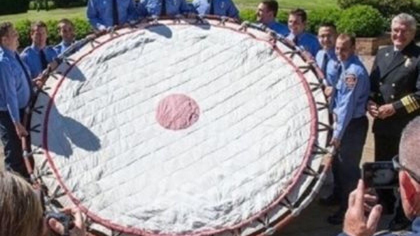 Pit Net Rescue Line Fire recruits present restored lifesaving net to chief
