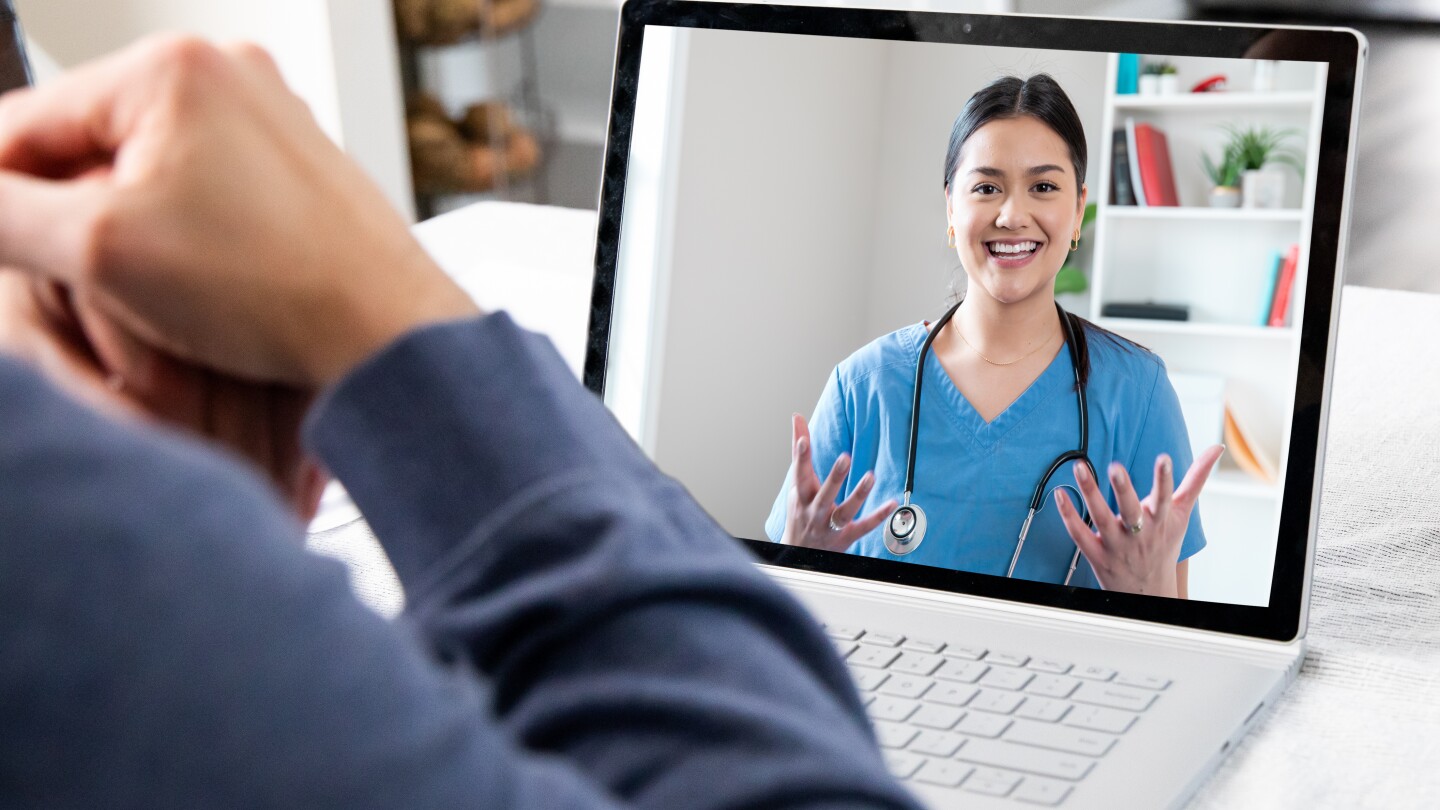 Patient at home while on video conference call with Doctor
