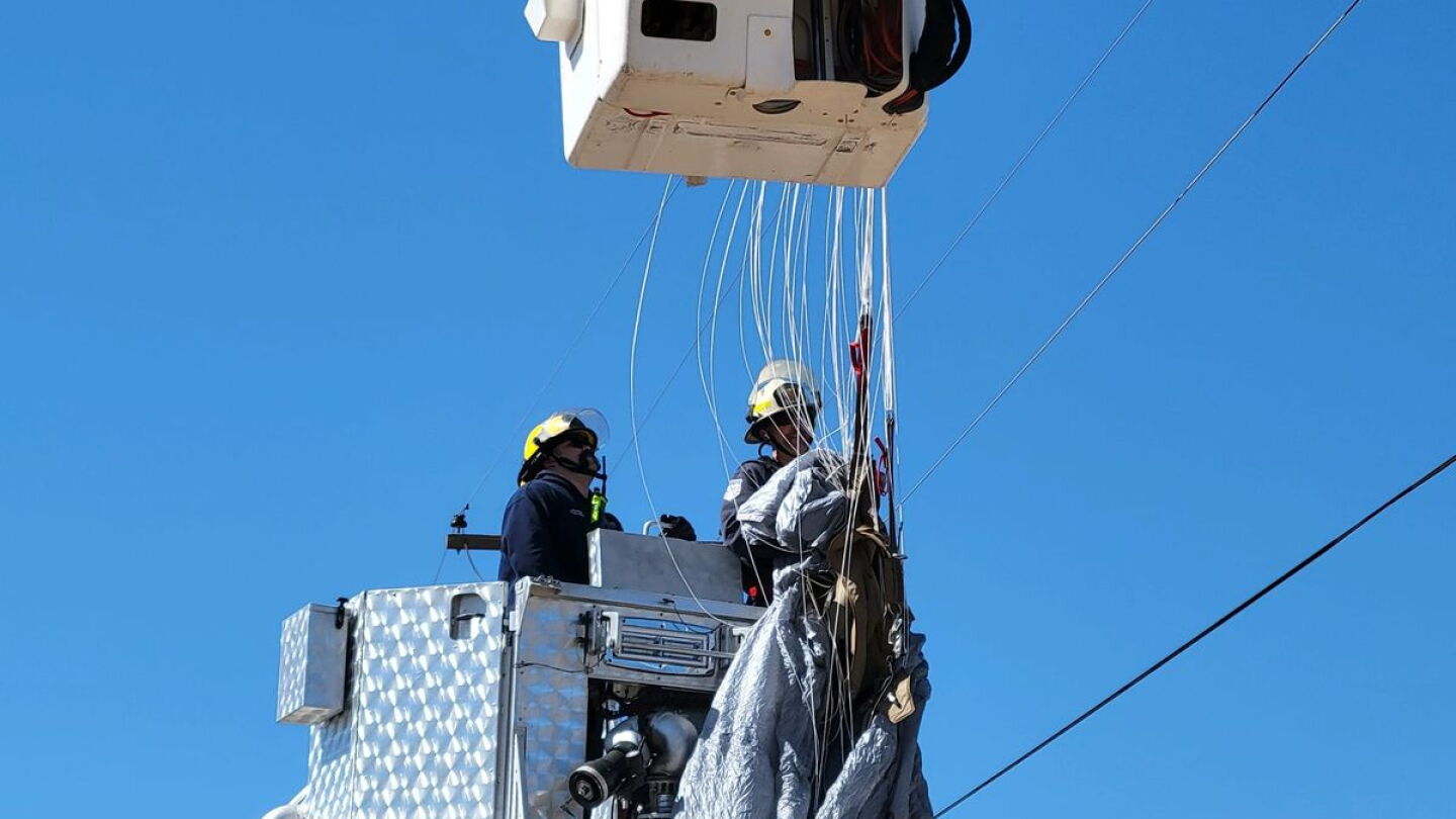 Skydiver Rescued Photos: Ariz. firefighters rescue skydiver after parachute becomes ...