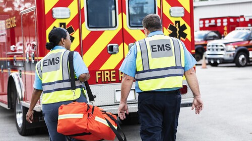 Paramedic and EMT team walking toward rescue ambulance