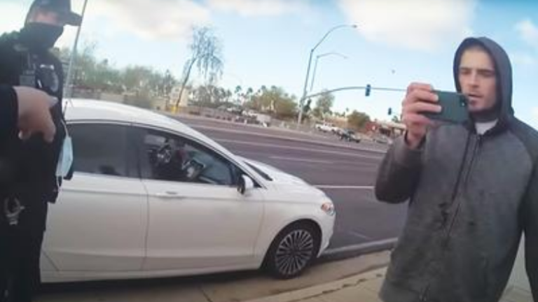 Ariz. 'guerilla journalist' jailed for police filming, accessing ...