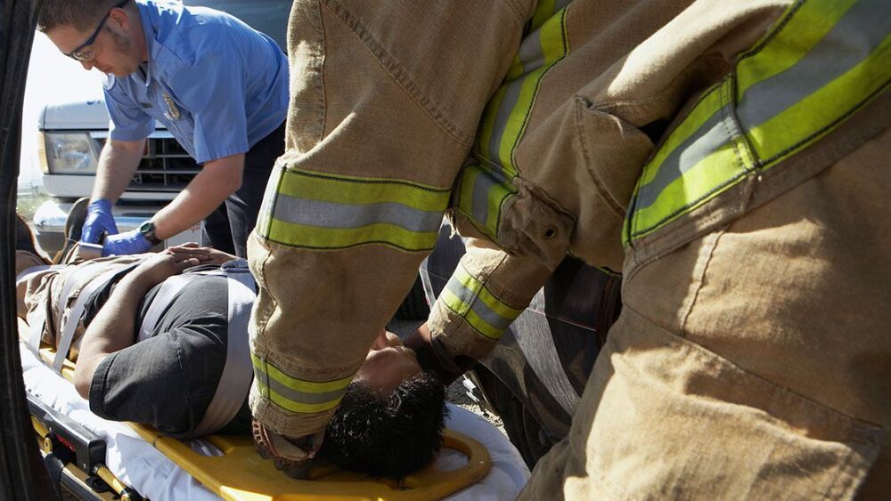 medic-firefighter-patient-stretcher-1200x630.jpg