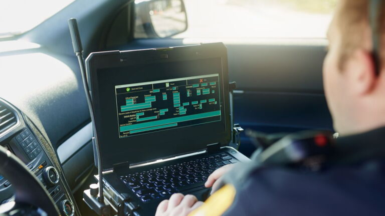 Police Man Using Data Profiling How data driven policing improves public safety, transparency