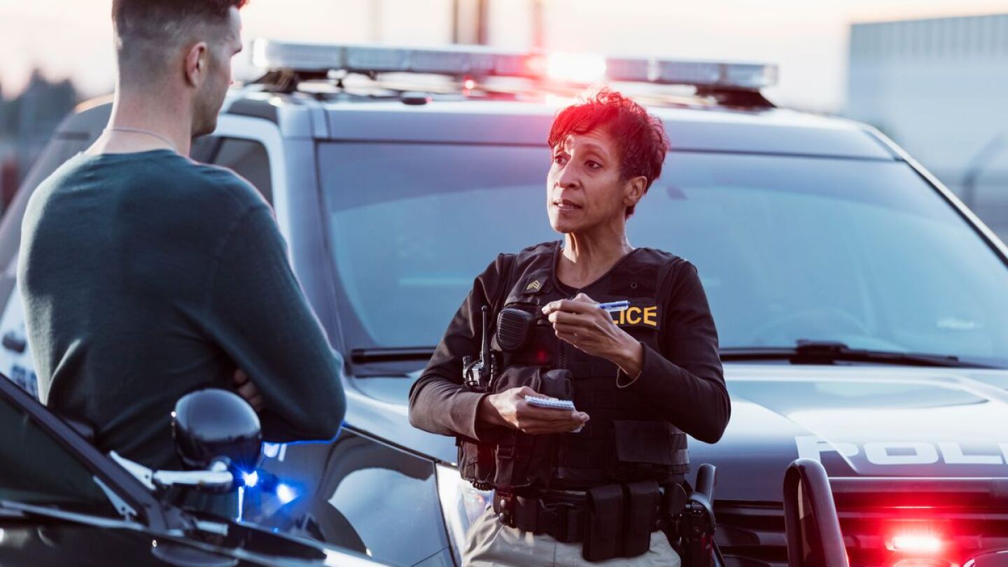 Female officer report writing ettyImages-1199109742.jpg