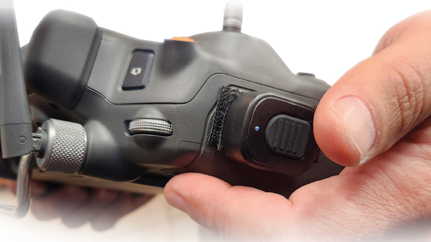 Talk Controllers Push-to-talk switch attaches to drone controller