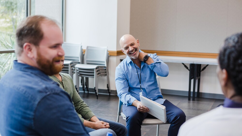 Diverse group of men meet