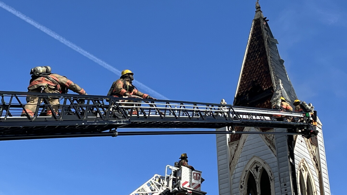 Steaple Rise Firefighting Md. firefighters battle church steeple fire