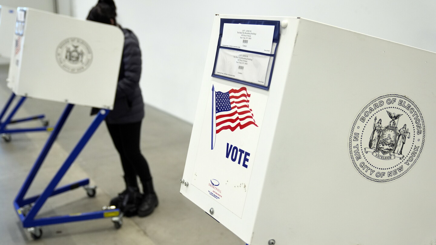 Federal Bureau of Prisons employees serve as election monitors at polling sites