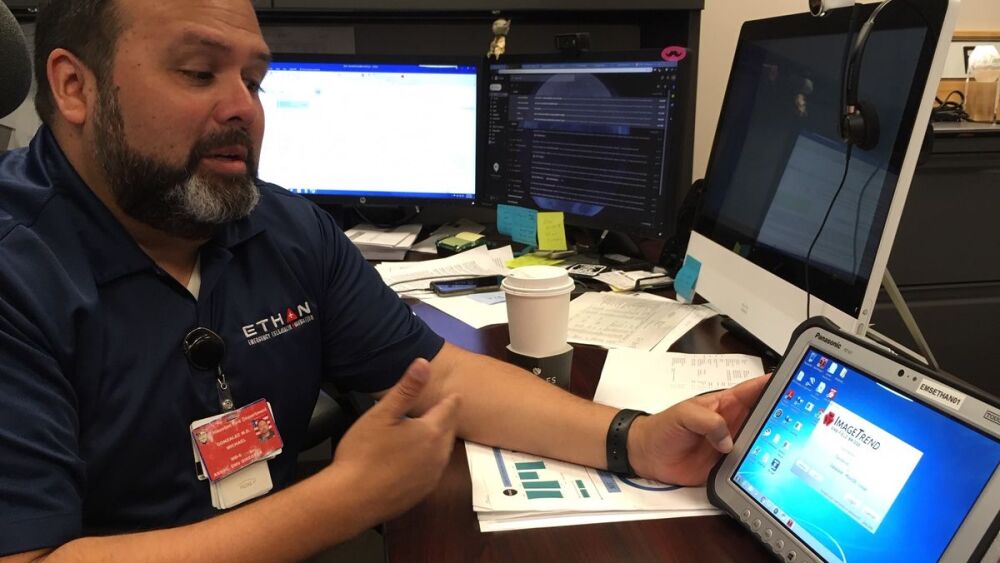 Dr. Michael Gonzalez demonstrates the software that manages the Houston Fire Department’s ETHAN telemedicine program.