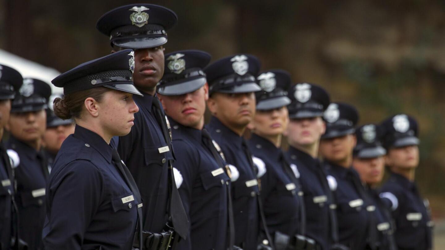 LAPD Chief Michel Moore, Mayor Eric Garcetti at graduation ceremony.