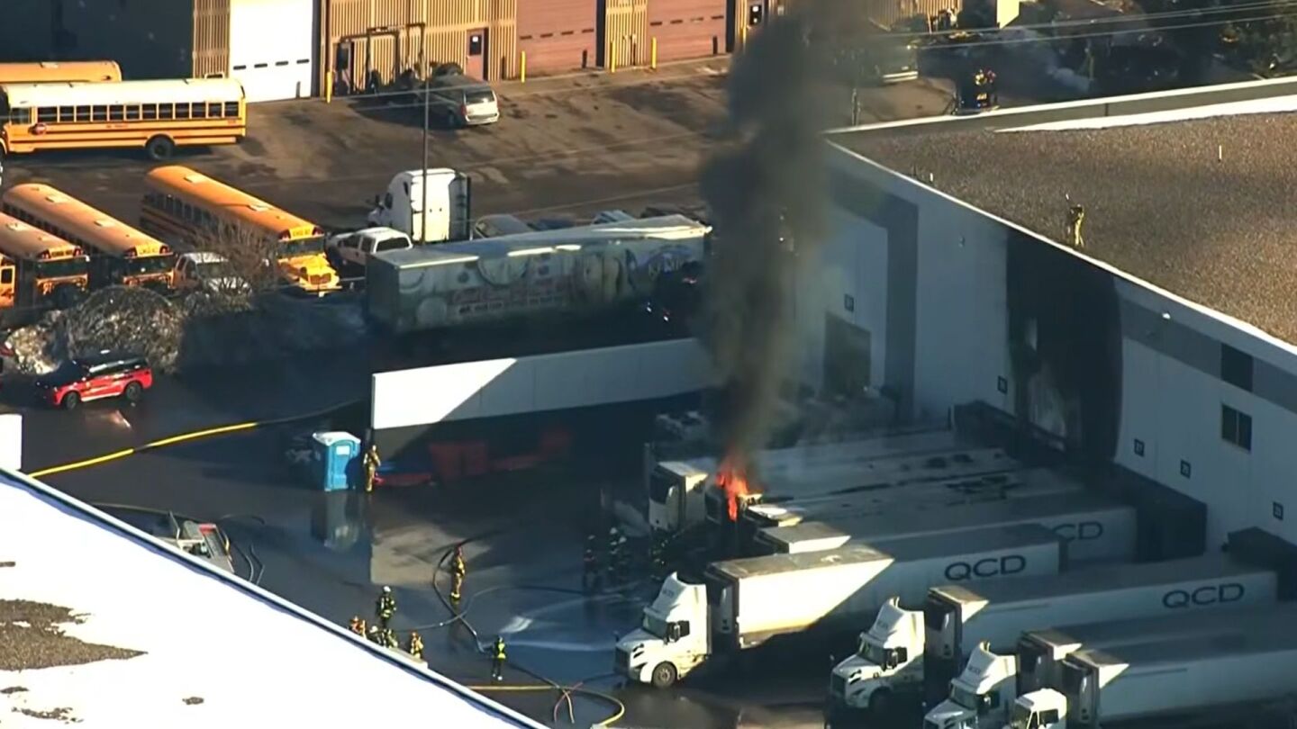 Minn. firefighters rescue worker trapped in a cooler as semi-trailers burn