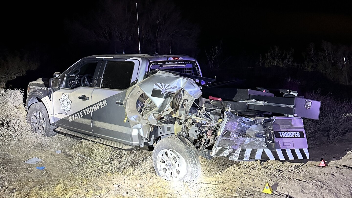 Truck towing trailer with 3 cars slams into trooper along highway, AZ cops say
